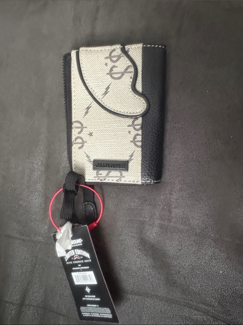 Sprayground Black and Cream RFID Phone Wallet with Red Wrist Ring